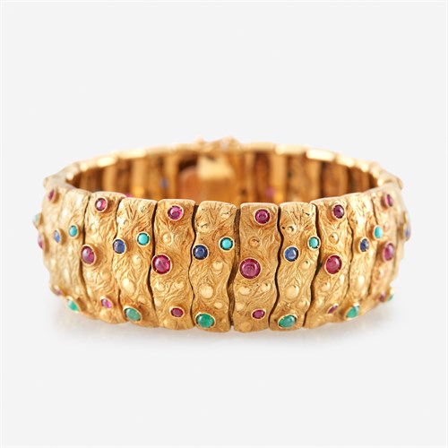 Lot 44 - An eighteen karat gold and gem-set bracelet
