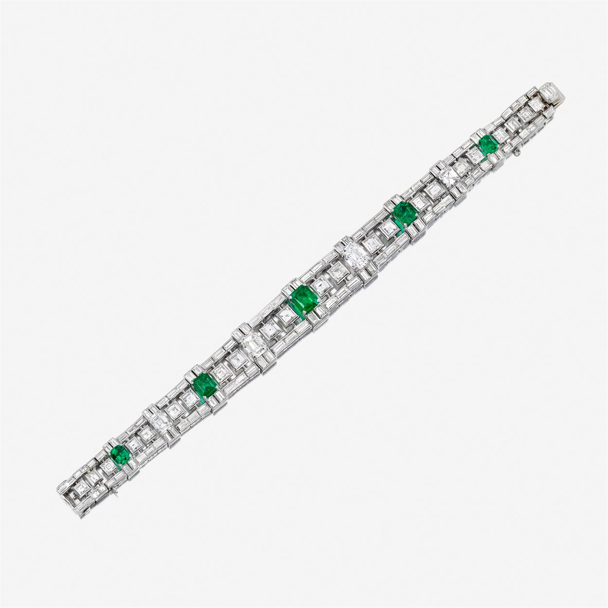 Lot 113 - A diamond, emerald, and eighteen karat white gold bracelet, Bulgari