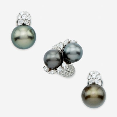 Lot 56 - A Tahitian black cultured pearl, diamond, eighteen karat white gold earclips and ring