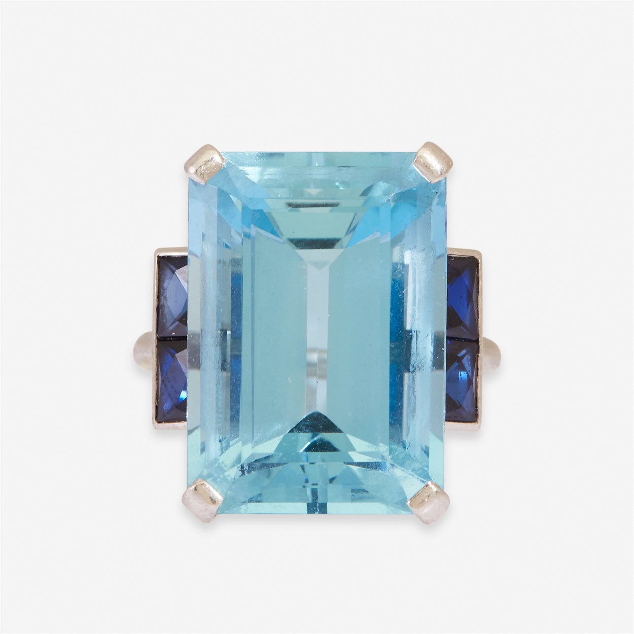 Lot 3 - An aquamarine, sapphire, and platinum ring, Cartier