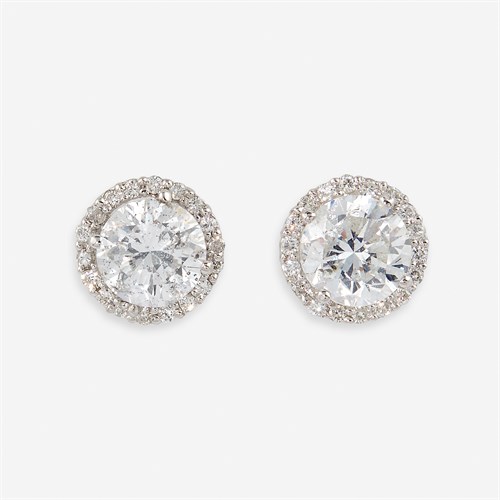 Lot 60 - A pair of diamond and eighteen karat white gold stud earrings
