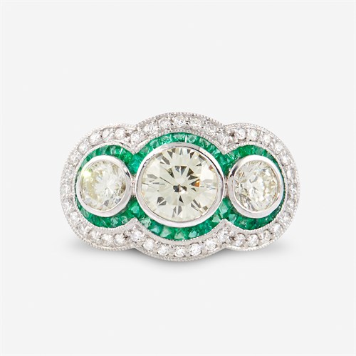 Lot 24 - A diamond, emerald, and platinum ring