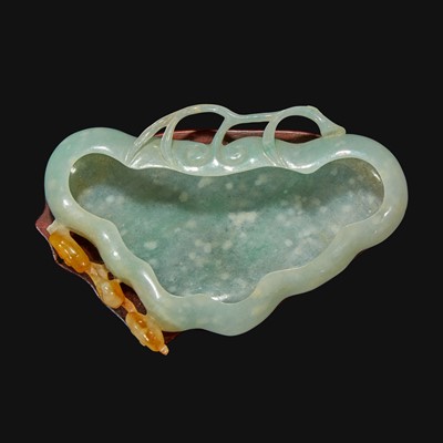 Lot 107 - A Chinese carved pale greenish-white and russet jadeite brush washer