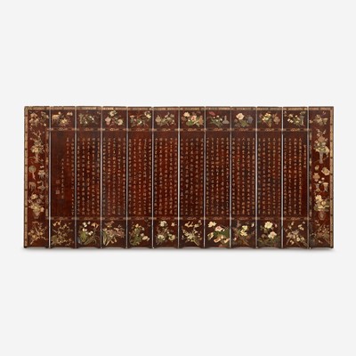 Lot 81 - A Chinese carved twelve-panel "Coromandel" folding screen