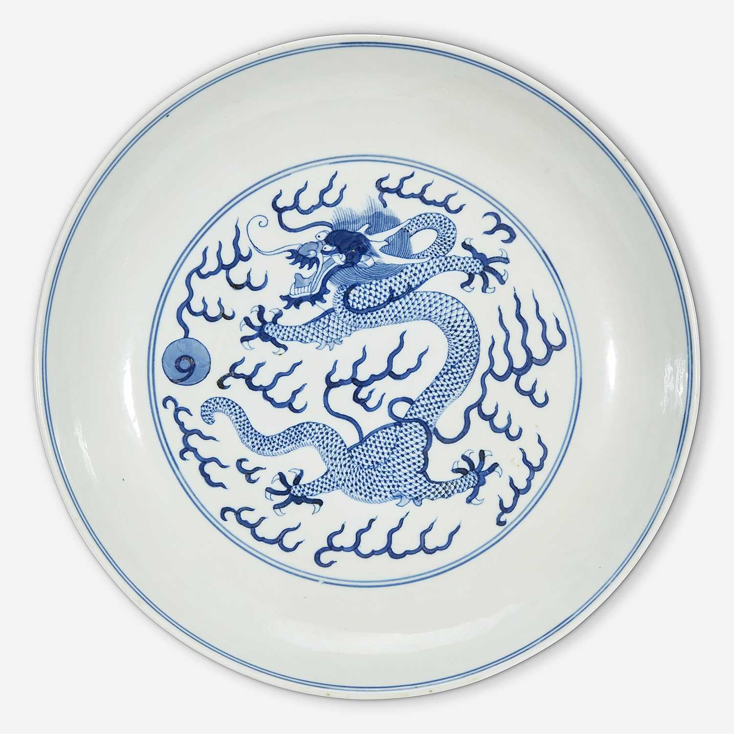Lot 18 - A Chinese blue and white porcelain "Dragon" dish