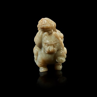 Lot 86 - A Chinese greyish white jade carving of a foreigner on a mythical beast