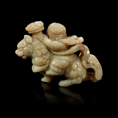 Lot 86 - A Chinese greyish white jade carving of a foreigner on a mythical beast