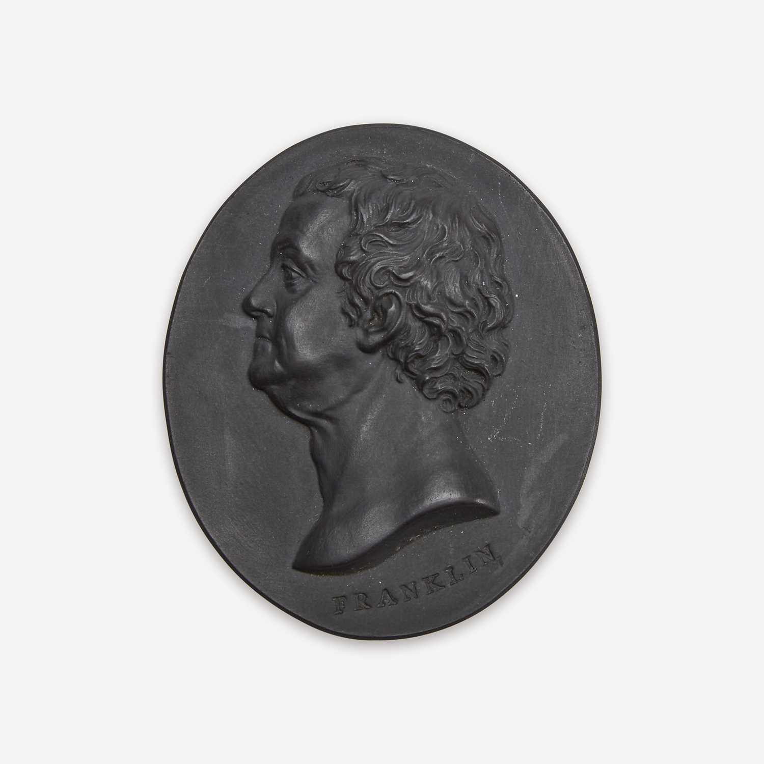 Lot 38 - A Wedgwood & Bentley black basalt portrait medallion of Benjamin Franklin (1706-1790)