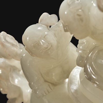 Lot 89 - A Chinese carved white jade "Boys" vase and cover