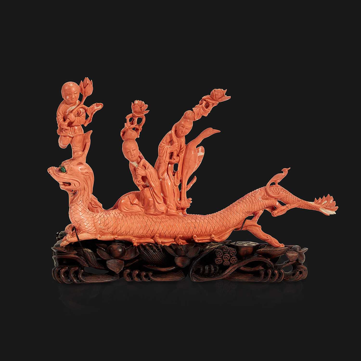 Lot 94 - A Chinese carved coral "Dragon, Boy, and Meiren" group