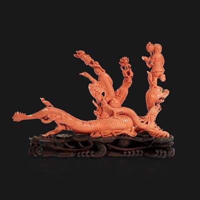 Lot 94 - A Chinese carved coral "Dragon, Boy, and Meiren" group
