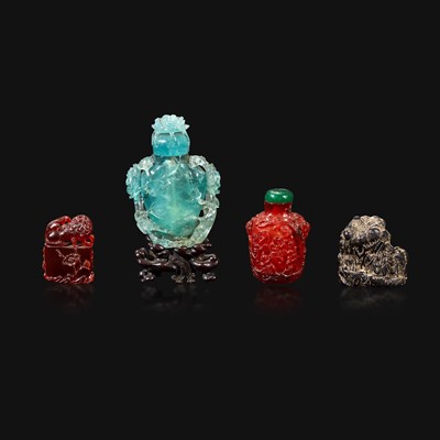 Lot 98 - A Chinese carved aquamarine snuff bottle, an amber lion-form seal, and an amber snuff bottle