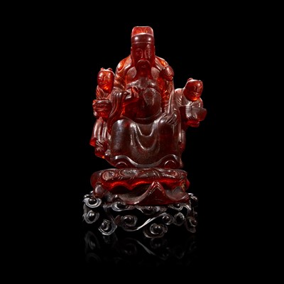 Lot 97 - A Chinese carved amber figure of a sage and acolytes