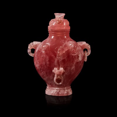 Lot 101 - A Chinese carved rose quartz archaistic vase and cover