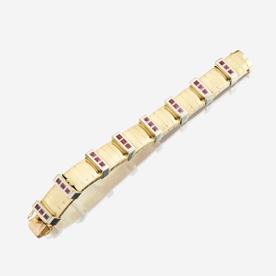 Lot 69 - An eighteen karat bicolor gold and pink sapphire bracelet