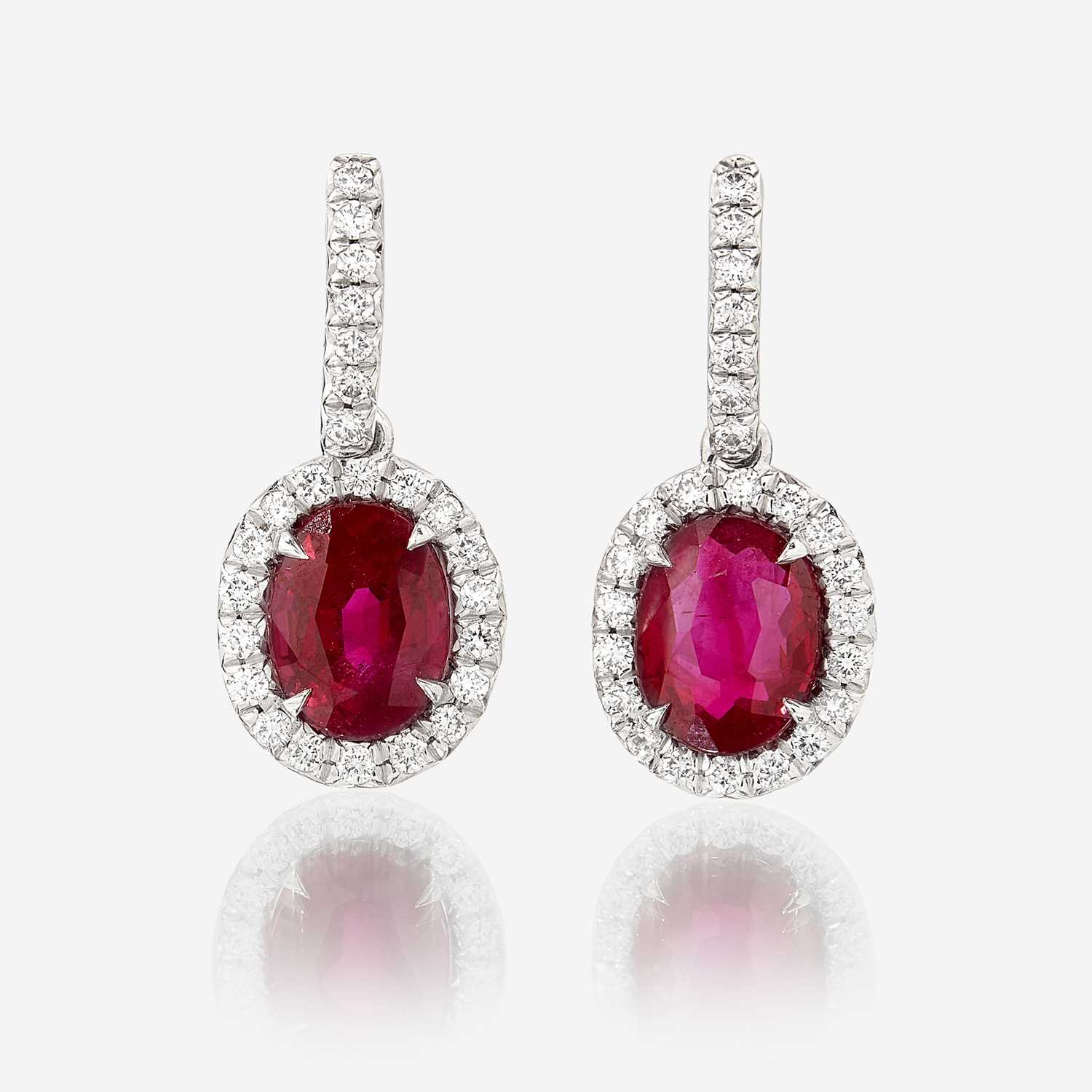 Lot 101 - A pair of ruby, diamond, and platinum earrings