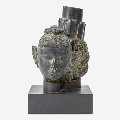 Lot 119 - An Indian carved black stone head of a female