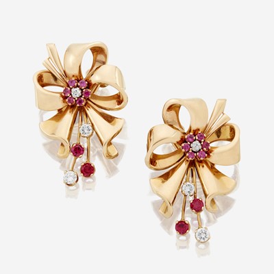 Lot 26 - A pair of Retro eighteen karat gold and diamond earrings