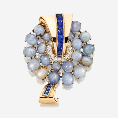 Lot 30 - A sapphire, white stone, and gold brooch