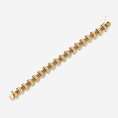 Lot 38 - A fourteen karat gold and sapphire bracelet