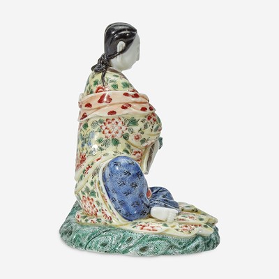 Lot 9 - A Chinese enameled Dehua porcelain figure of Guanyin seated