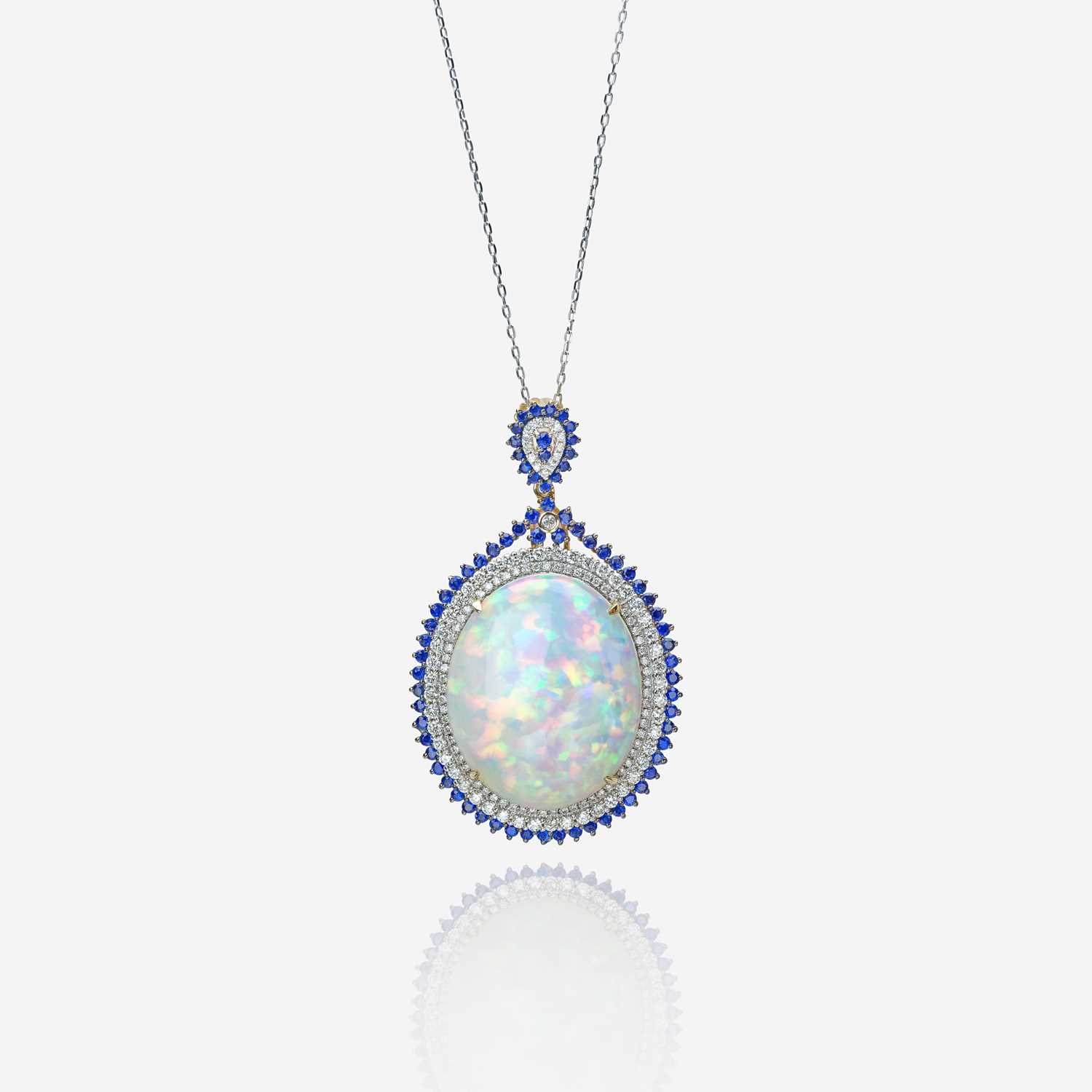 Lot 110 - An opal, diamond, sapphire, and fourteen karat gold pendant with chain