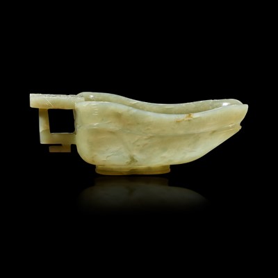 Lot 103 - A Chinese celadon jade libation cup, Yi, and a carved grey-white jade oval "Dragon" plaque