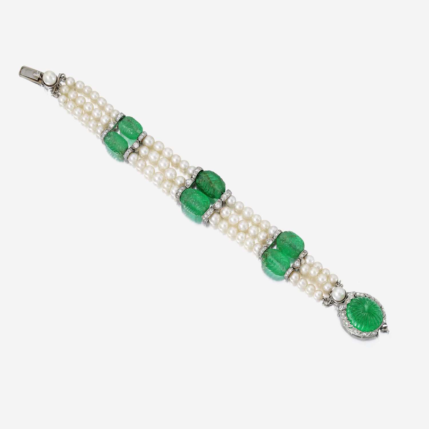 Lot 137 - An Art Deco carved emerald, pearl, and diamond bracelet