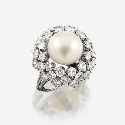 Lot 103 - A cultured pearl, diamond, and eighteen karat white gold ring