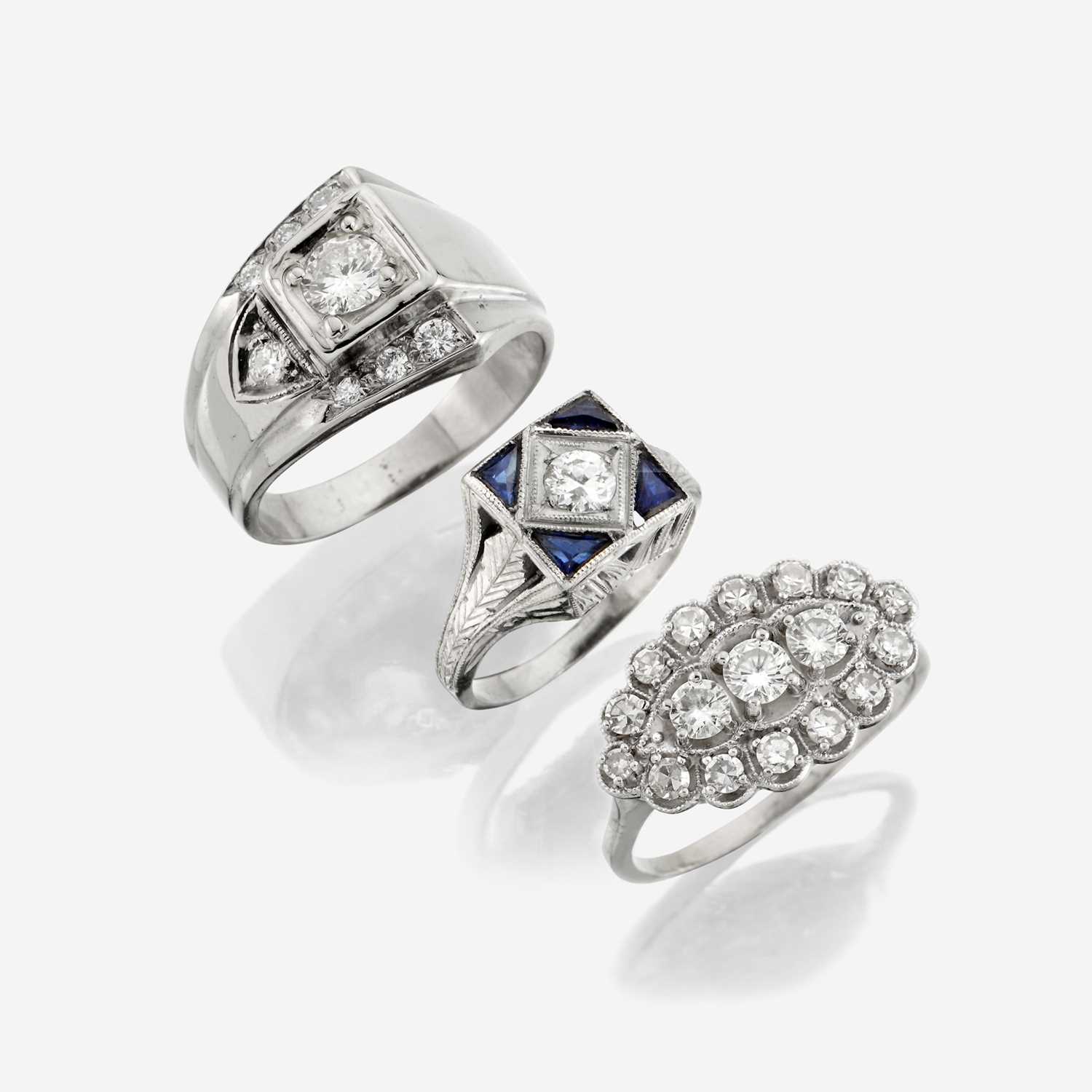 Lot 120 - A collection of three white gold and diamond rings