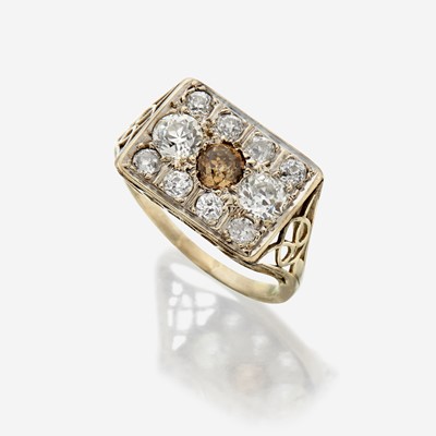 Lot 123 - A colored diamond, diamond, and fourteen karat white gold ring