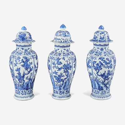 Lot 36 - Three Chinese blue and white porcelain baluster vases and covers