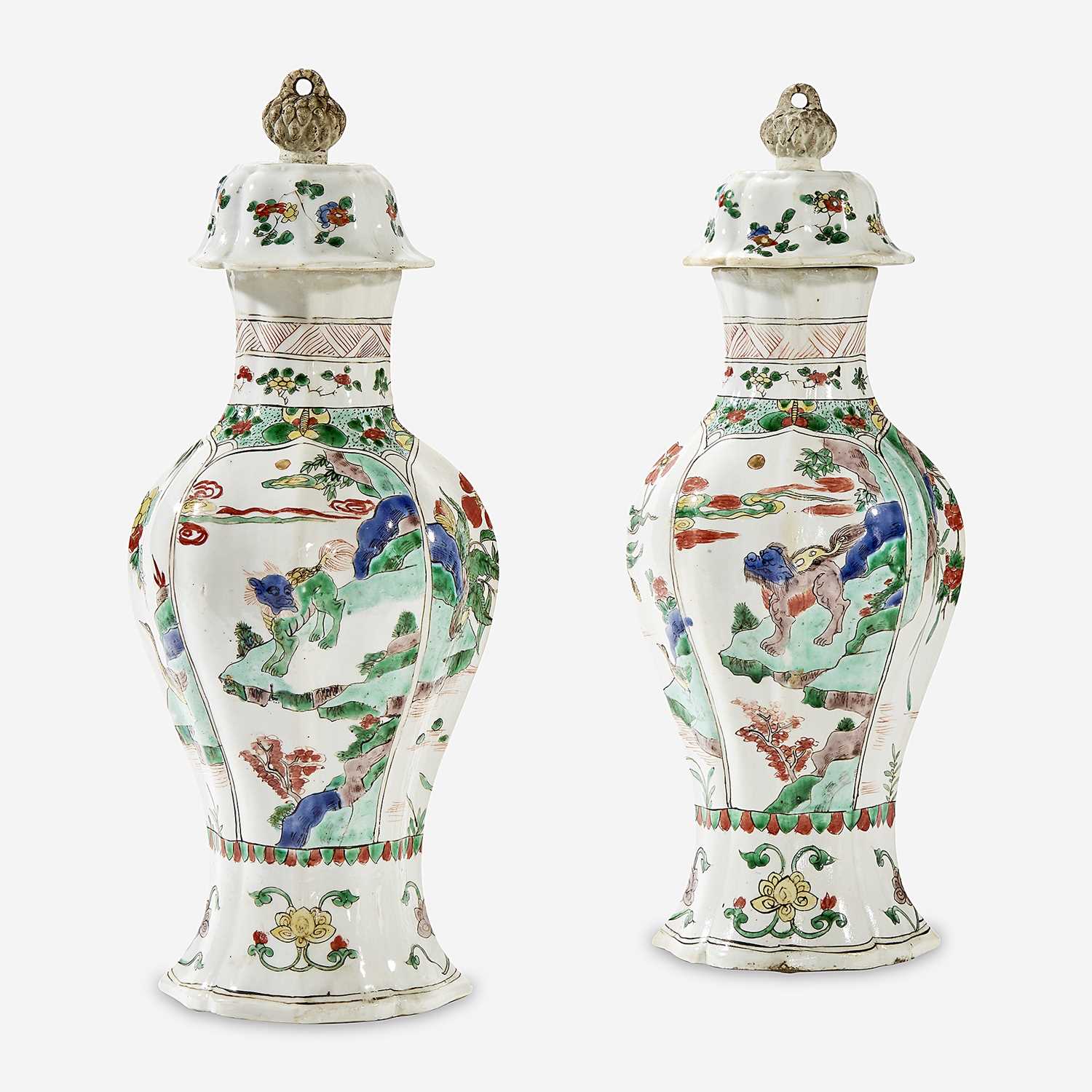 Lot 49 - A pair of Chinese famille verte-decorated porcelain baluster vases and covers