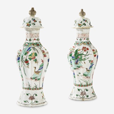 Lot 49 - A pair of Chinese famille verte-decorated porcelain baluster vases and covers