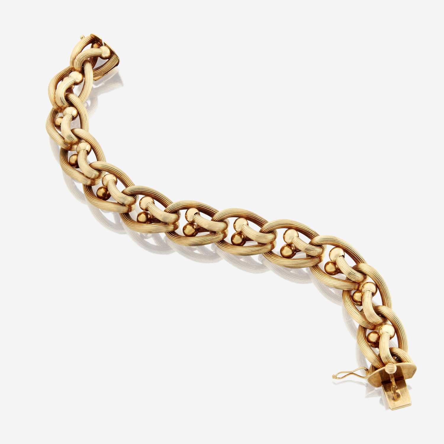 Lot 188 - An eighteen karat gold bracelet