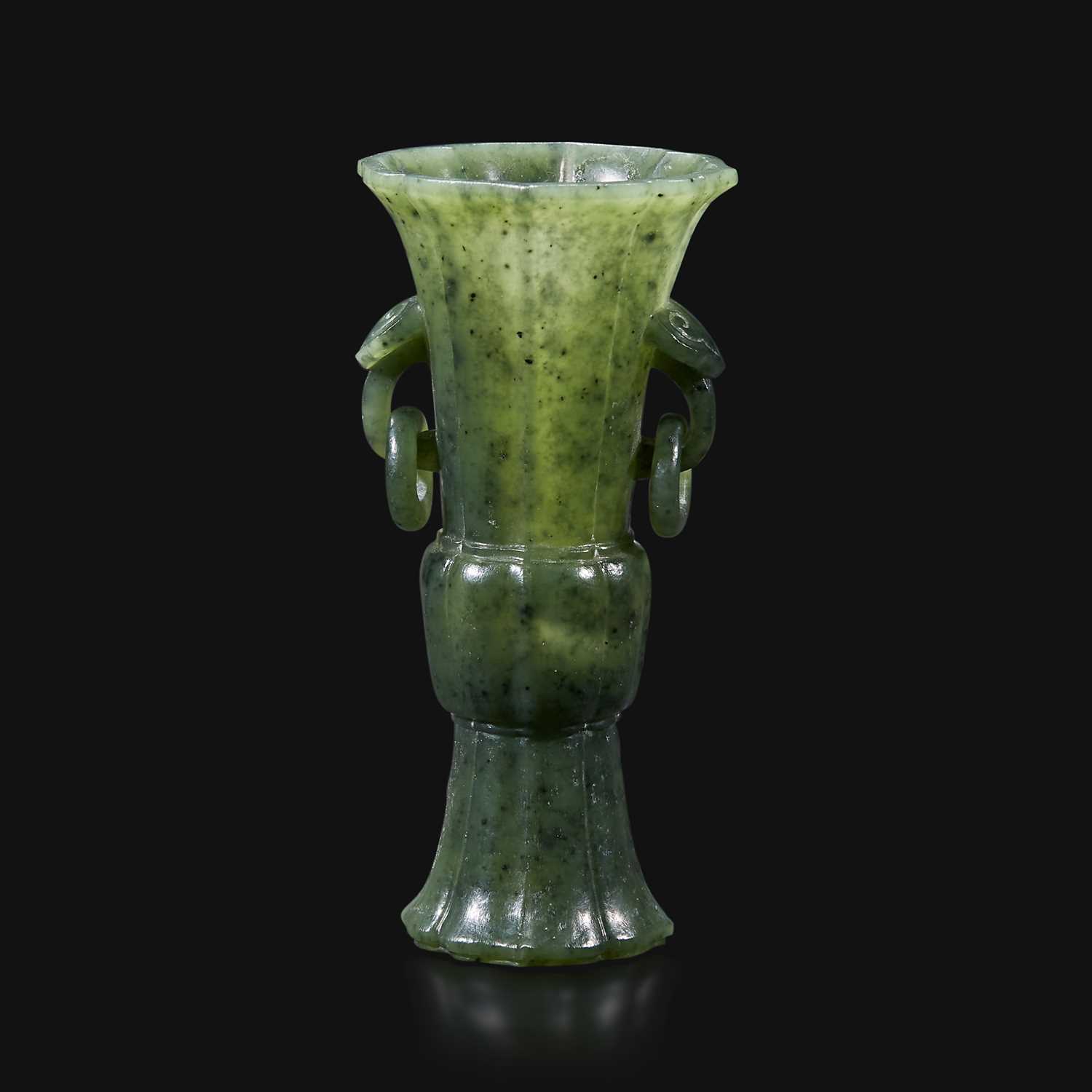 Lot 92 - A small Chinese carved spinach green jade lobed gu-form vase