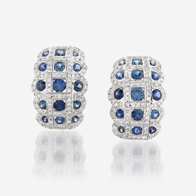 Lot 96 - A pair of sapphire, diamond, and eighteen karat white gold earrings