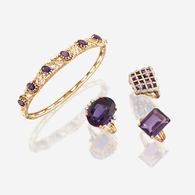 Lot 83 - A collection of four pieces of amethyst and gold jewelry