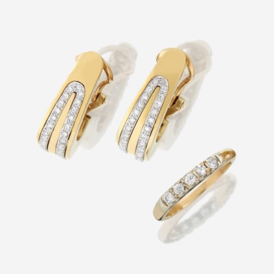 Lot 46 - A pair of fourteen karat gold and diamond earrings with similar ring