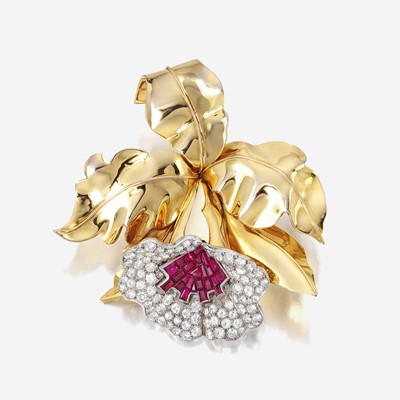 Lot 58 - A Retro diamond, ruby, and eighteen karat gold clip brooch
