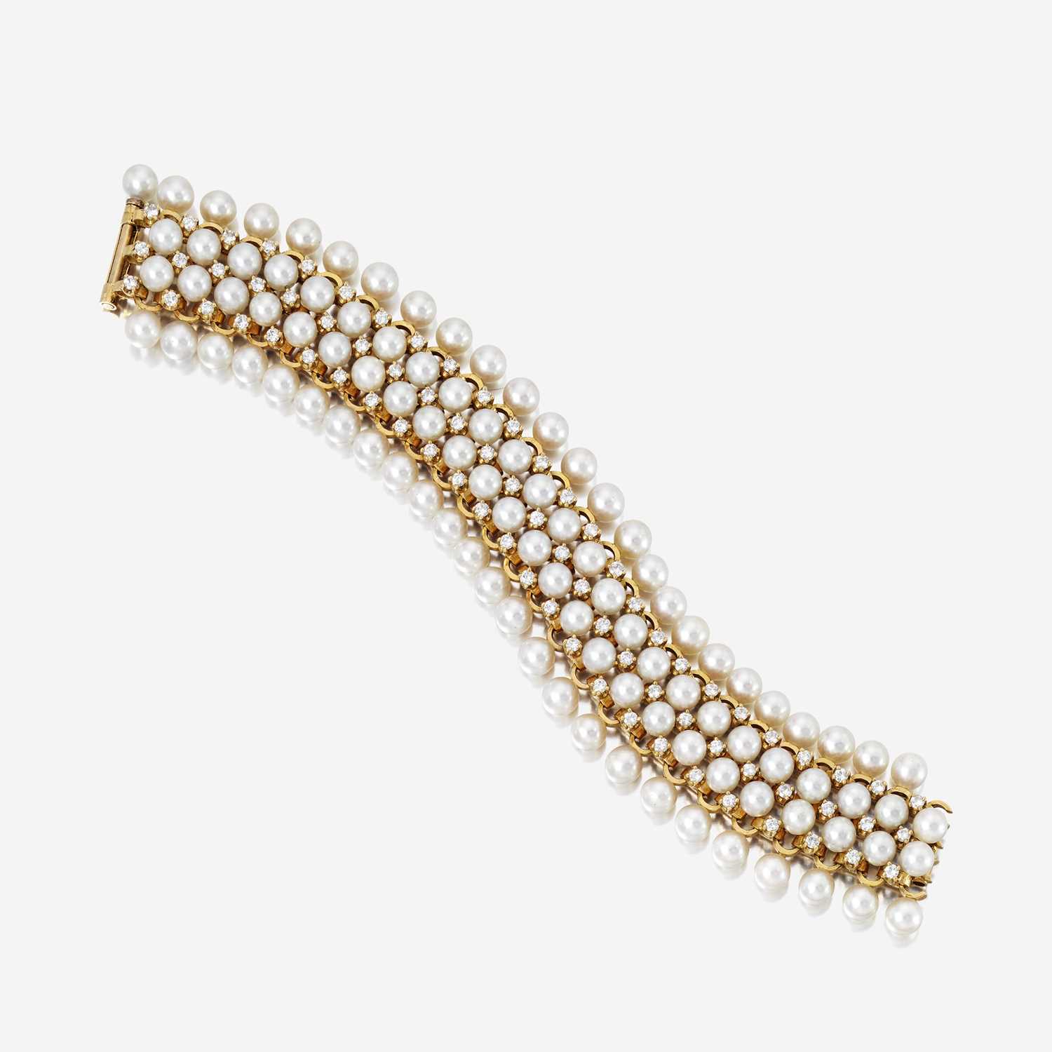 Lot 56 - An eighteen karat gold, cultured pearl, and diamond bracelet, Schlumberger