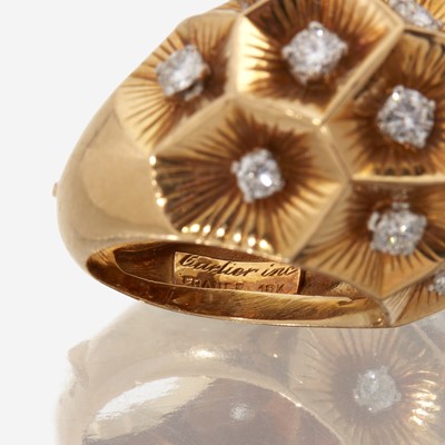 Lot 49 - An eighteen karat gold and diamond ring, Cartier