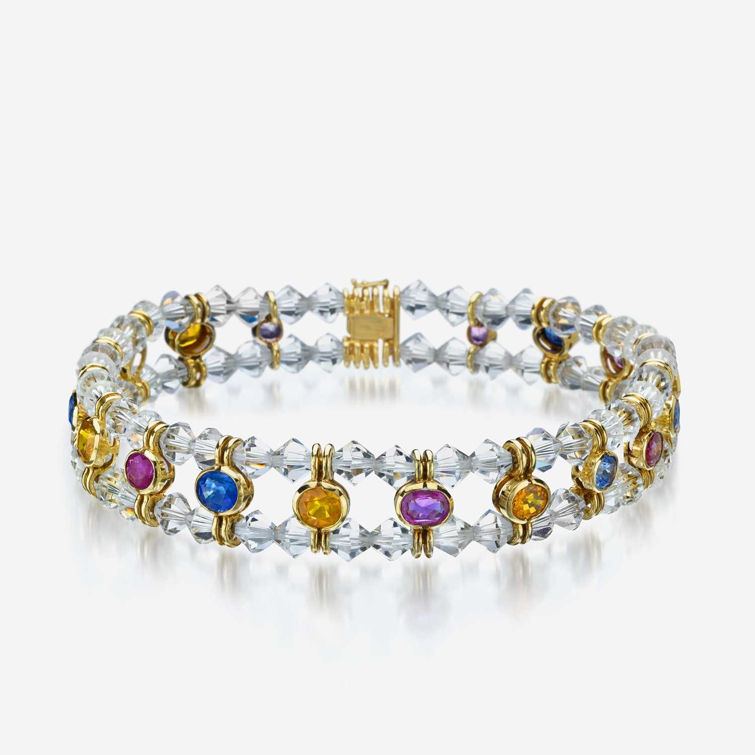 Lot 51 - An eighteen karat gold, colored sapphire, and rock crystal necklace, Bulgari