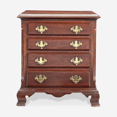 Lot 69 - A Chippendale miniature walnut chest of drawers