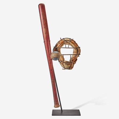 Lot 245 - A baseball assemblage: red stained softball bat, catcher's mask and practice ball