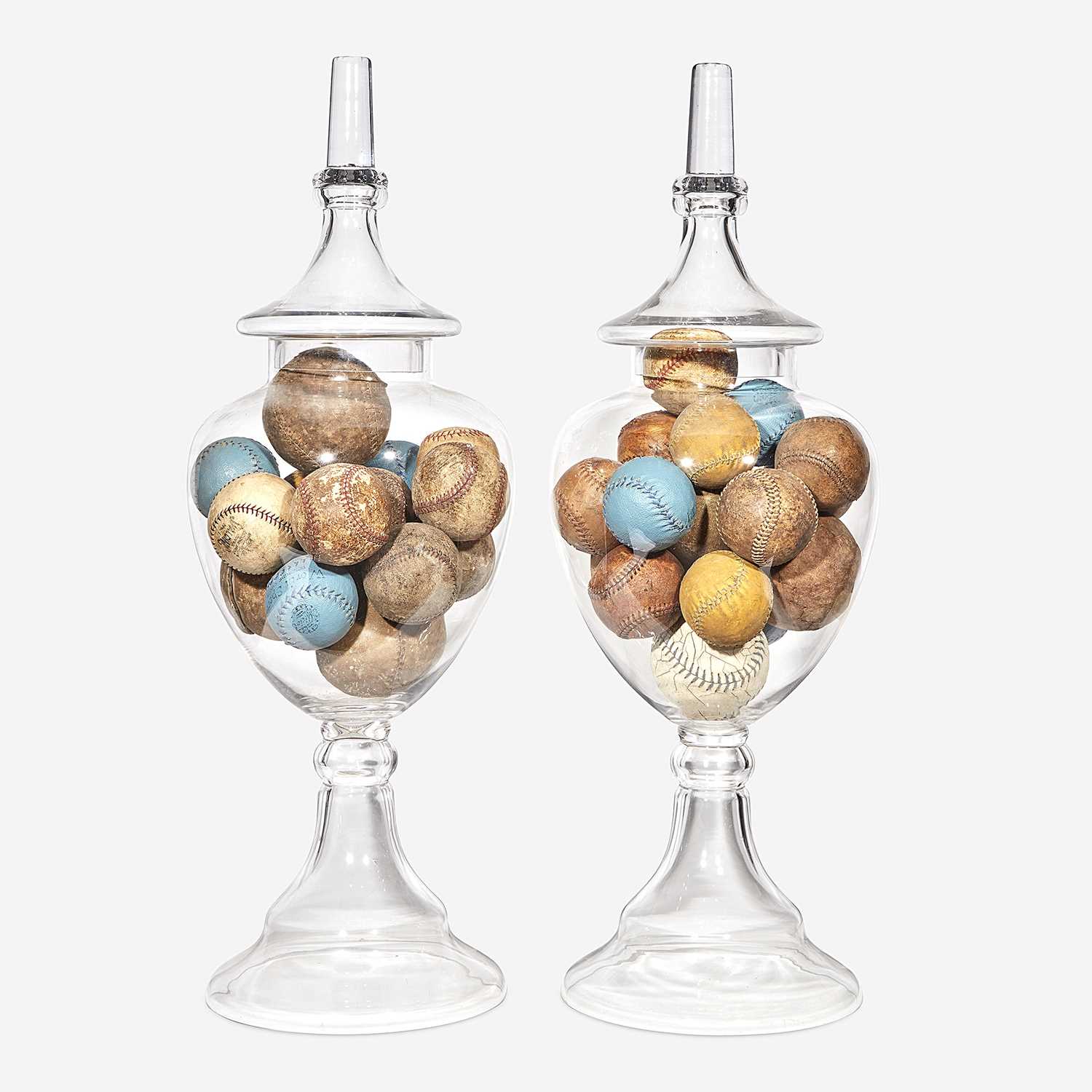 Lot 251 - Two uncolored glass apothecary jars filled with baseballs