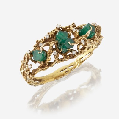 Lot 40 - A fourteen karat gold, green beryl crystal, and diamond bangle