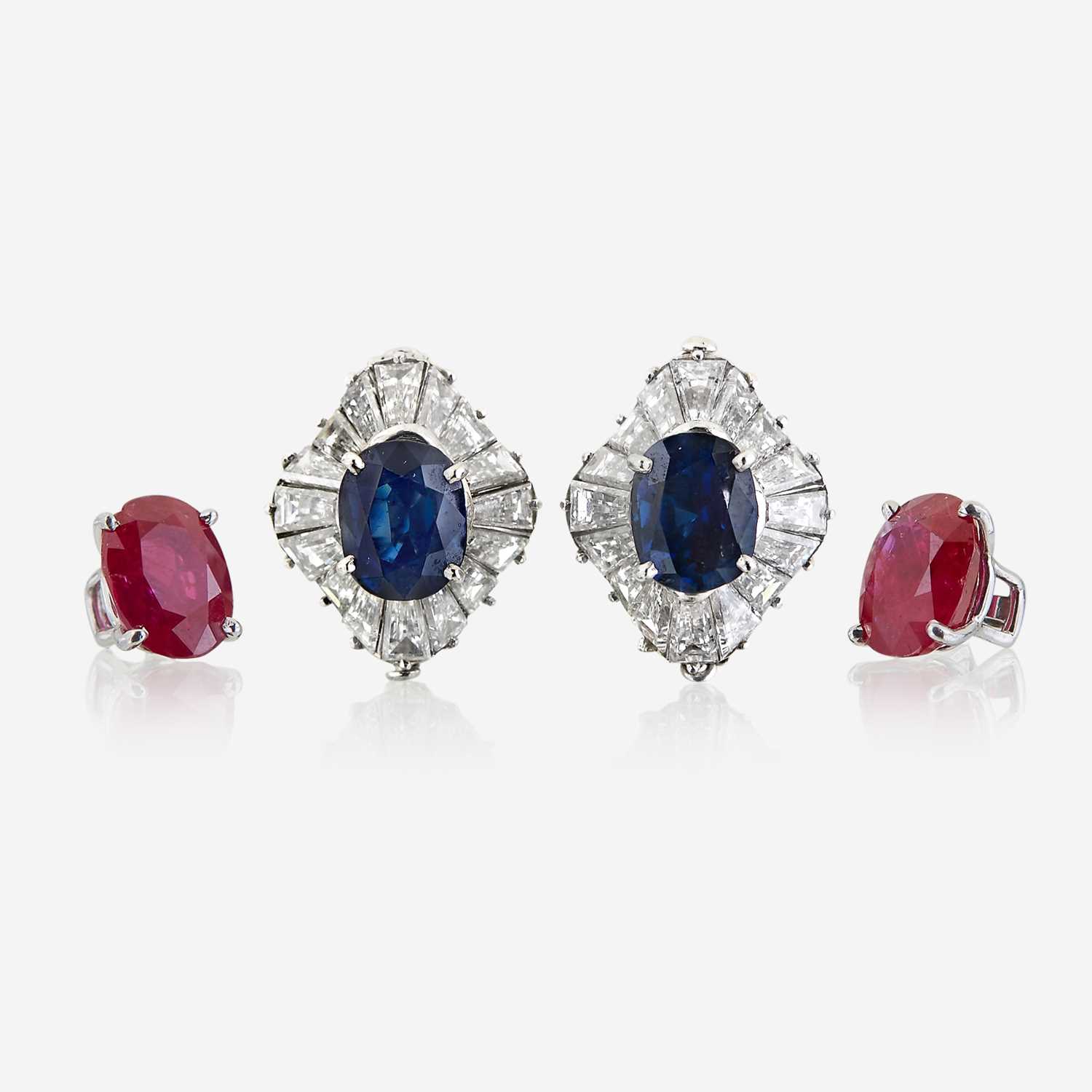 Lot 54 - A pair of diamond and platinum earring jackets with interchangeable ruby and sapphire studs