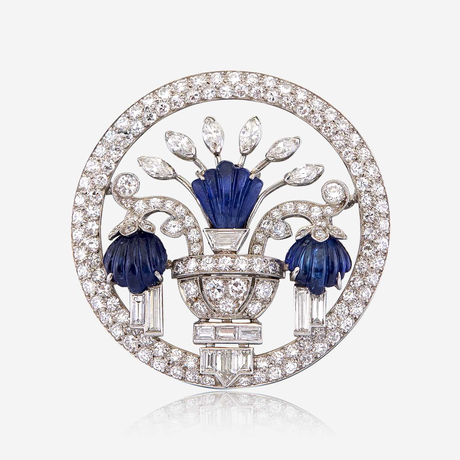 Lot 5 - A diamond, carved sapphire, and platinum brooch, J. E. Caldwell & Co.