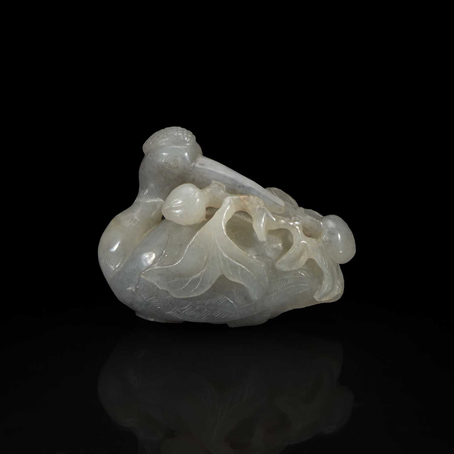 Lot 163 - A Chinese pale grey jade crane and peaches group